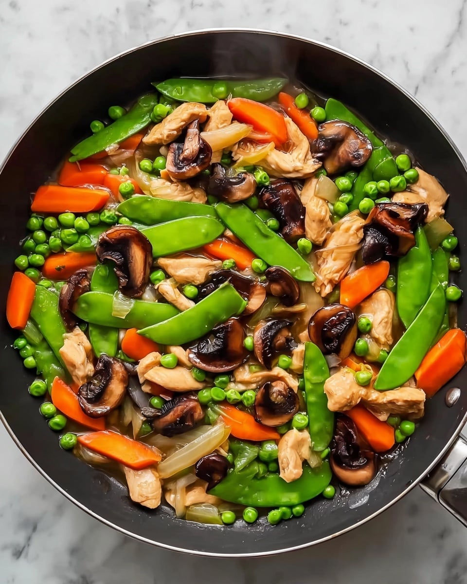 A bowl filled with a stir-fry showing three clear layers: the bottom layer has bright orange carrot slices, the middle layer shows glossy light brown sliced mushrooms, and the top layer features shiny green snap peas scattered evenly, all covered with a shiny glaze and sprinkled with white sesame seeds. The bowl is white and round, placed on a wooden board, with a pair of brown chopsticks resting on the edge. The background has a soft focus with a white marbled texture visible. Photo taken with an iphone --ar 4:5 --v 7