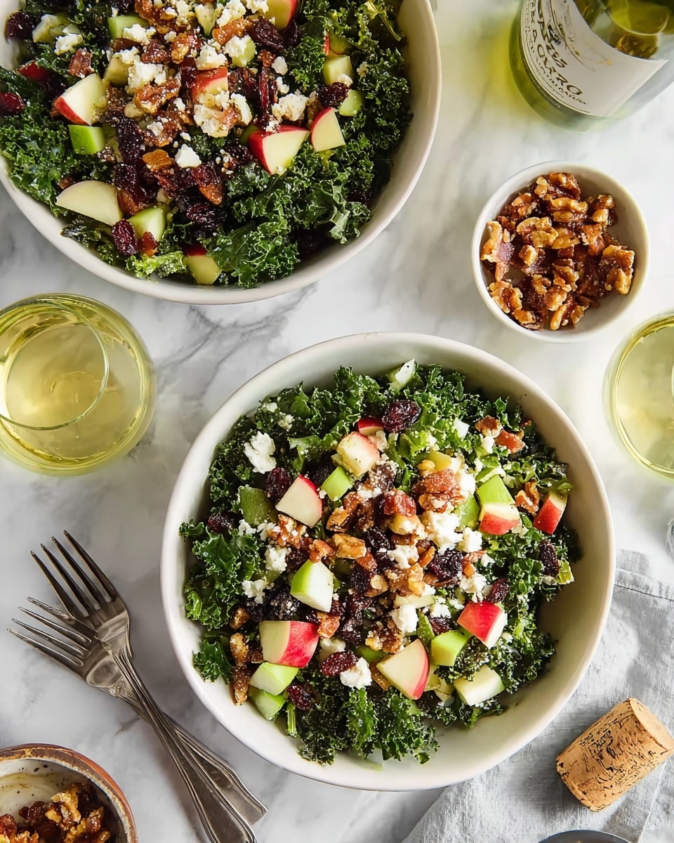 The image shows two white bowls filled with a fresh kale salad on a white marbled surface. Each bowl has a base layer of dark green, curly kale leaves topped with small chunks of red apple, light green celery pieces, crumbled white cheese, dark red dried cranberries, and brown candied nuts sprinkled throughout. There are also bits of crispy bacon adding a reddish-brown contrast. Around the bowls are a small white bowl with extra candied nuts, two green glasses with a light yellow drink, silver forks, and a wine bottle with a cork lying on the marble surface. photo taken with an iphone --ar 4:5 --v 7