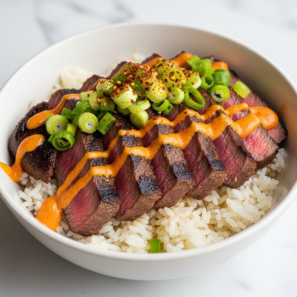 A bowl with a white outside holds a layered dish starting with a base of white rice that looks fluffy and soft. On top of the rice, there are several slices of grilled steak, cooked to medium with seared dark edges and a pink center. Over the steak, there is an orange sauce drizzled unevenly, and the entire dish is topped with finely chopped green onions and a sprinkling of red chili flakes, adding texture and color contrast. The bowl is placed on a white marbled surface. photo taken with an iphone --ar 4:5 --v 7