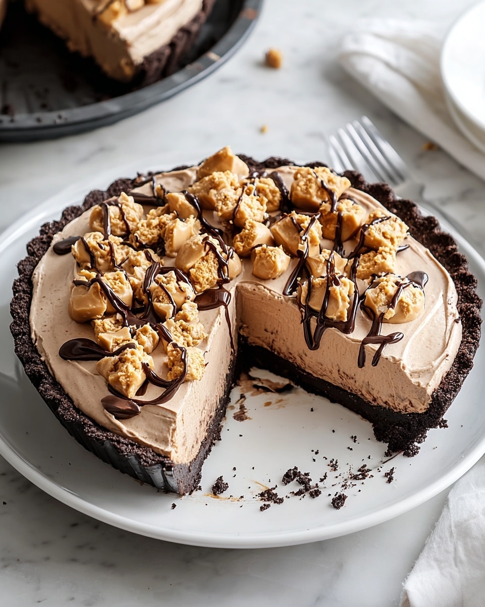 The image shows a three-layer dessert on a white plate placed on a white marbled surface. The bottom layer is a dark, thick, crumbly crust forming the base and edges. The middle layer is a light brown creamy filling spread smoothly over the crust. On top, there is a generous drizzle of dark chocolate sauce along with crumbled yellow pieces scattered mainly in the center. A wedge-shaped slice has been removed from the dessert, exposing the distinct layers and the smooth cream inside. Photo taken with an iphone --ar 4:5 --v 7