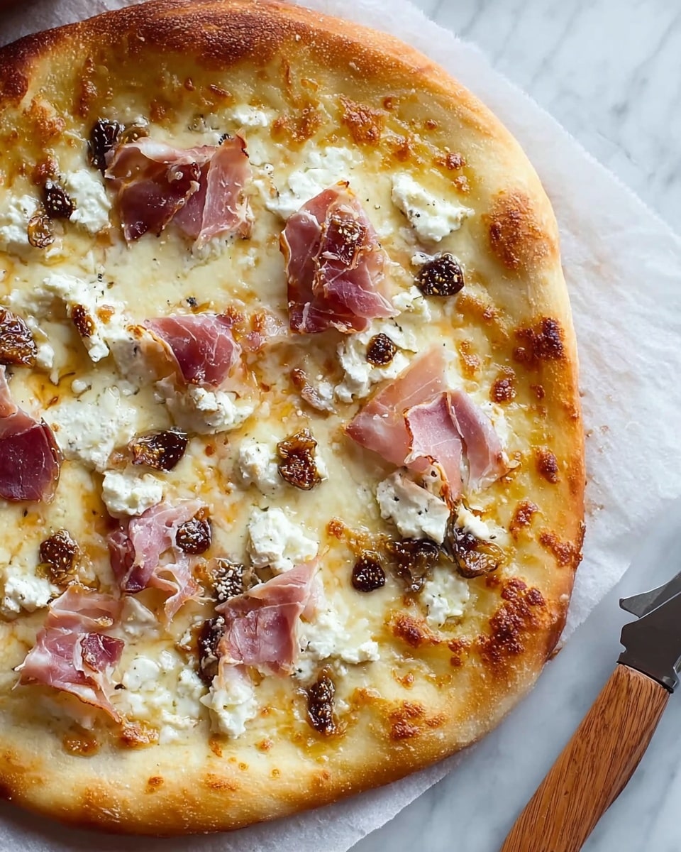 A close-up of a cooked pizza with a thick golden crust around the edges. The pizza has a base layer of melted white cheese with some golden brown spots. On top, there are pieces of thinly sliced cooked ham that have a slightly crispy look, along with scattered chunks of white creamy cheese and small dark brown bits that appear to be dried figs or a similar fruit. The pizza is placed on white parchment paper set on a white marbled surface. A wooden-handled metal pizza cutter is nearby on the right edge of the image, with a woman's hand about to hold it, photo taken with an iphone --ar 4:5 --v 7