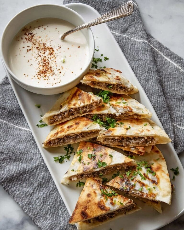 Arayes: Grilled or Baked Pita Sandwiches Filled with Spiced Ground Meat and Served with Tahini Dipping Sauce Recipe