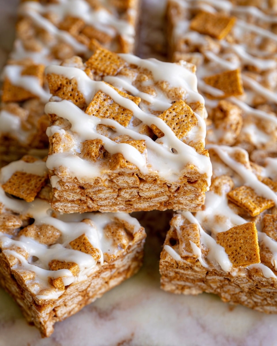 This image shows several square cereal treat pieces stacked close together on a surface with a white marbled texture. Each piece has two visible layers: a thick base layer made of tightly packed light beige cereal squares with a slightly rough texture, and a topping layer of crunchy brown cereal squares scattered on top. A white icing is generously drizzled over all pieces, creating smooth, glossy streaks running across the cereal layers in uneven lines. The focus is sharp on the center pieces, showing the texture of the cereal and the sheen of the icing. Photo taken with an iphone --ar 4:5 --v 7